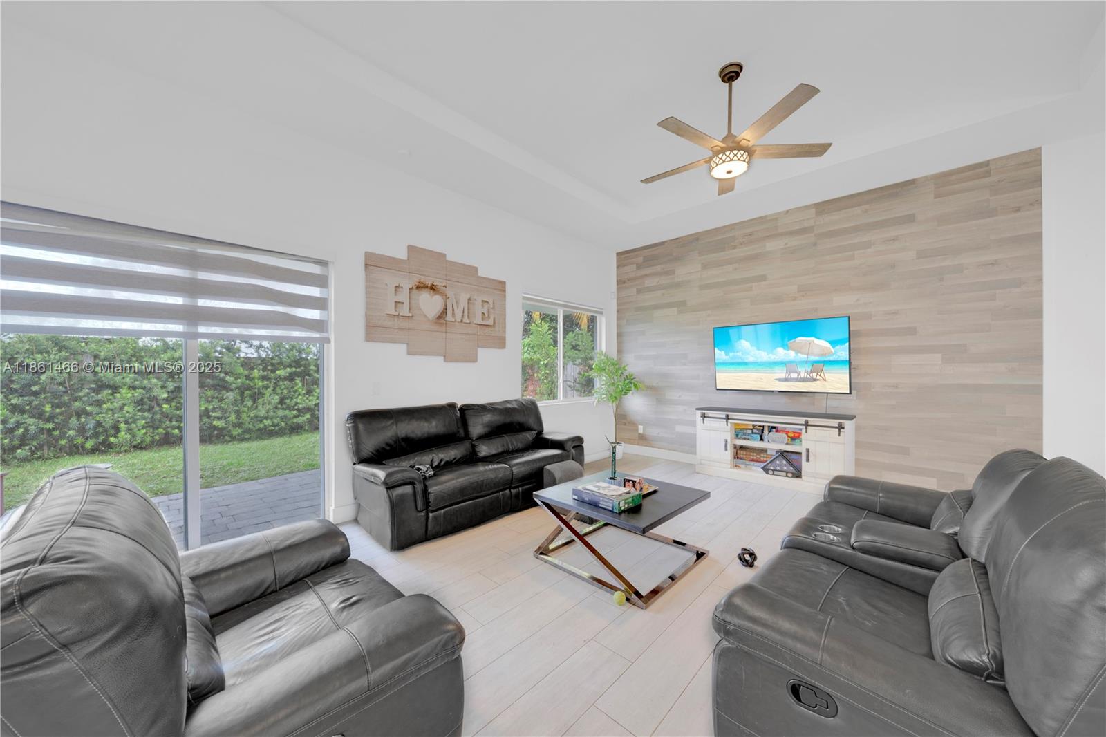 15012 Southwest 177th Terrace Miami, FL 33187 - Photo 7 of 16 a living room with furniture and a large window