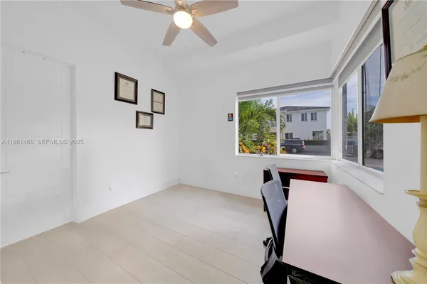 a workspace with furniture and window