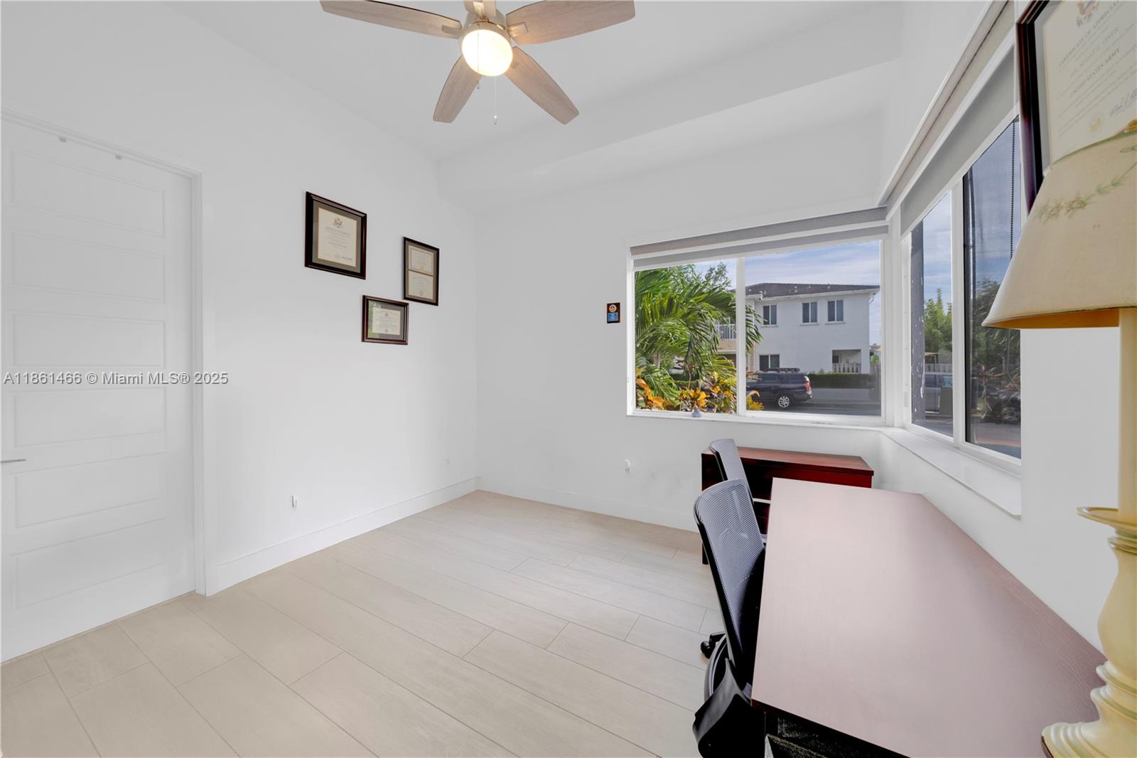 15012 Southwest 177th Terrace Miami, FL 33187 - Photo 8 of 16 a workspace with furniture and window