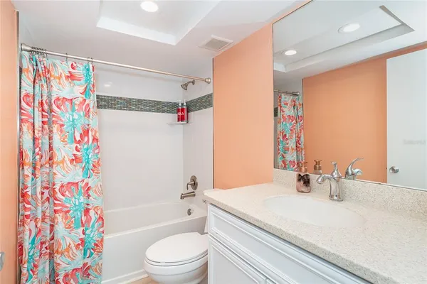 a bathroom with a sink a toilet and a bathtub