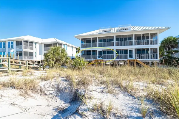 a view of residential houses with yard