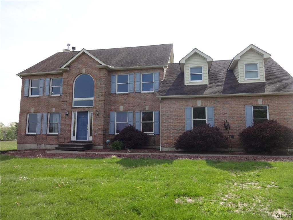 2311 Yost Road Bath, PA 18014 - Photo 1 of 21 a front view of a house with a yard