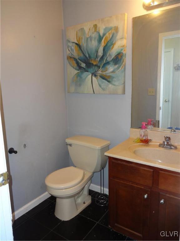 2311 Yost Road Bath, PA 18014 - Photo 16 of 21 a bathroom with a toilet a sink and mirror