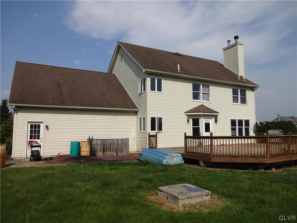 2311 Yost Road Bath, PA 18014 - Photo 8 of 21 a view of a house with a yard and deck