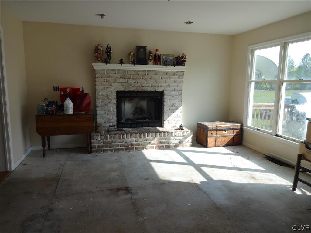 2311 Yost Road Bath, PA 18014 - Photo 10 of 21 a living room with furniture and a fireplace