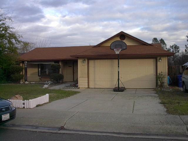 3657 Santa Rosa Way Redding, CA 96003 - Photo 1 of 3 a front view of a house with a garden and yard