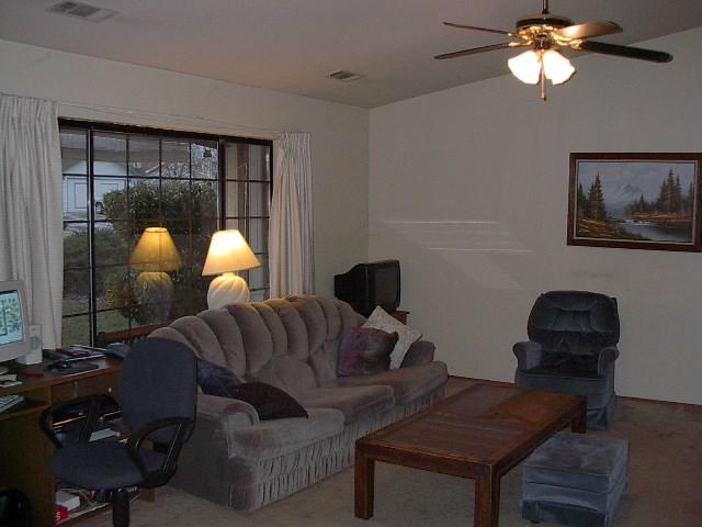 3657 Santa Rosa Way Redding, CA 96003 - Photo 2 of 3 a living room with furniture and a large window