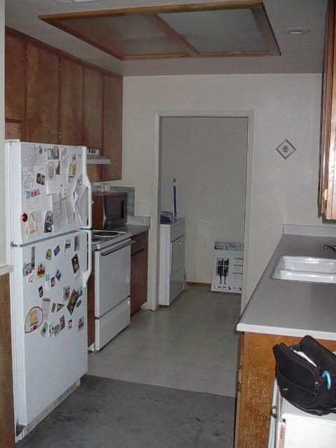3657 Santa Rosa Way Redding, CA 96003 - Photo 3 of 3 a kitchen with stainless steel appliances a refrigerator and a stove top oven
