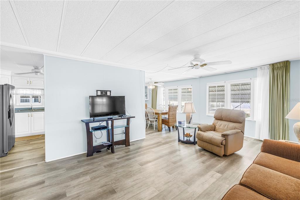 1100 South Belcher Road, Unit 502 Largo, FL 33771 - Photo 16 of 51 a living room with furniture and a flat screen tv