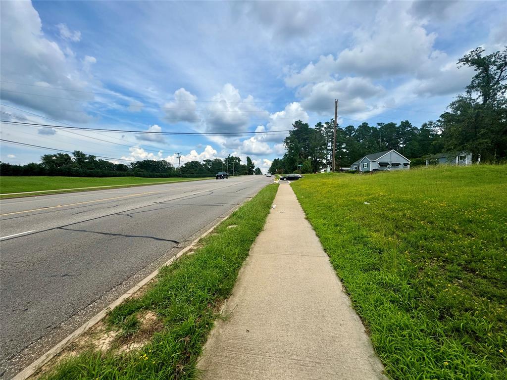 3328 West Erwin Street Tyler, TX 75702 - Photo 5 of 5 a view of a city street with a big yard