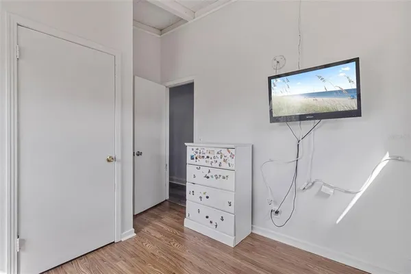 a view of a livingroom with wooden floor