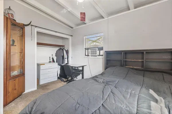 a bedroom with a bed and a cabinets