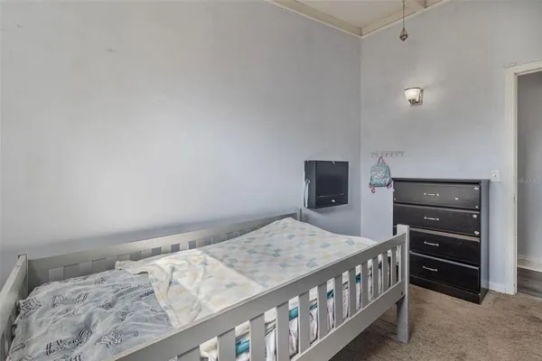 a bedroom with a bed and cabinets