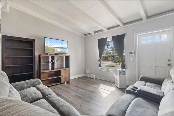 a living room with furniture and a window