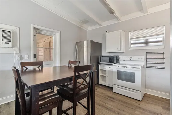a kitchen with a stove a sink and a refrigerator