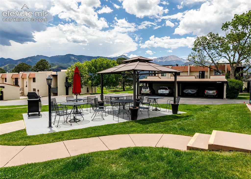 1034 Fontmore Road, Unit D Colorado Springs, CO 80904 - Photo 37 of 43 a view of a house with a yard porch and sitting area