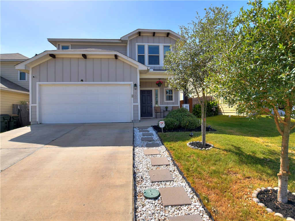 304 Triumph Road Buda, TX 78610 - Photo 1 of 1 a front view of house with garden