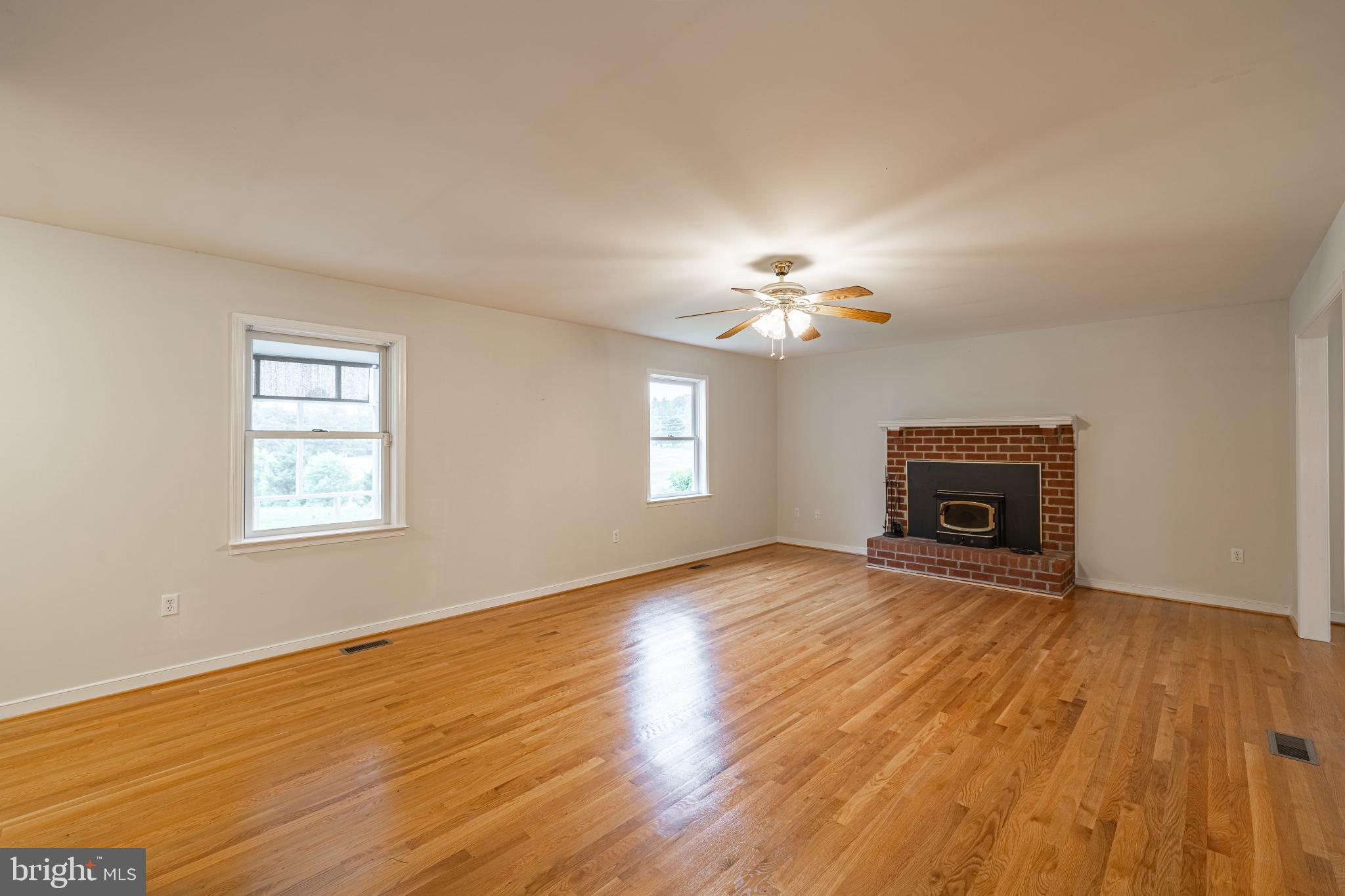 16302 Pleasant Mill Road Montpelier, VA 23192 - Photo 9 of 44 Bright LR w/ transitional flow..woodburning FP