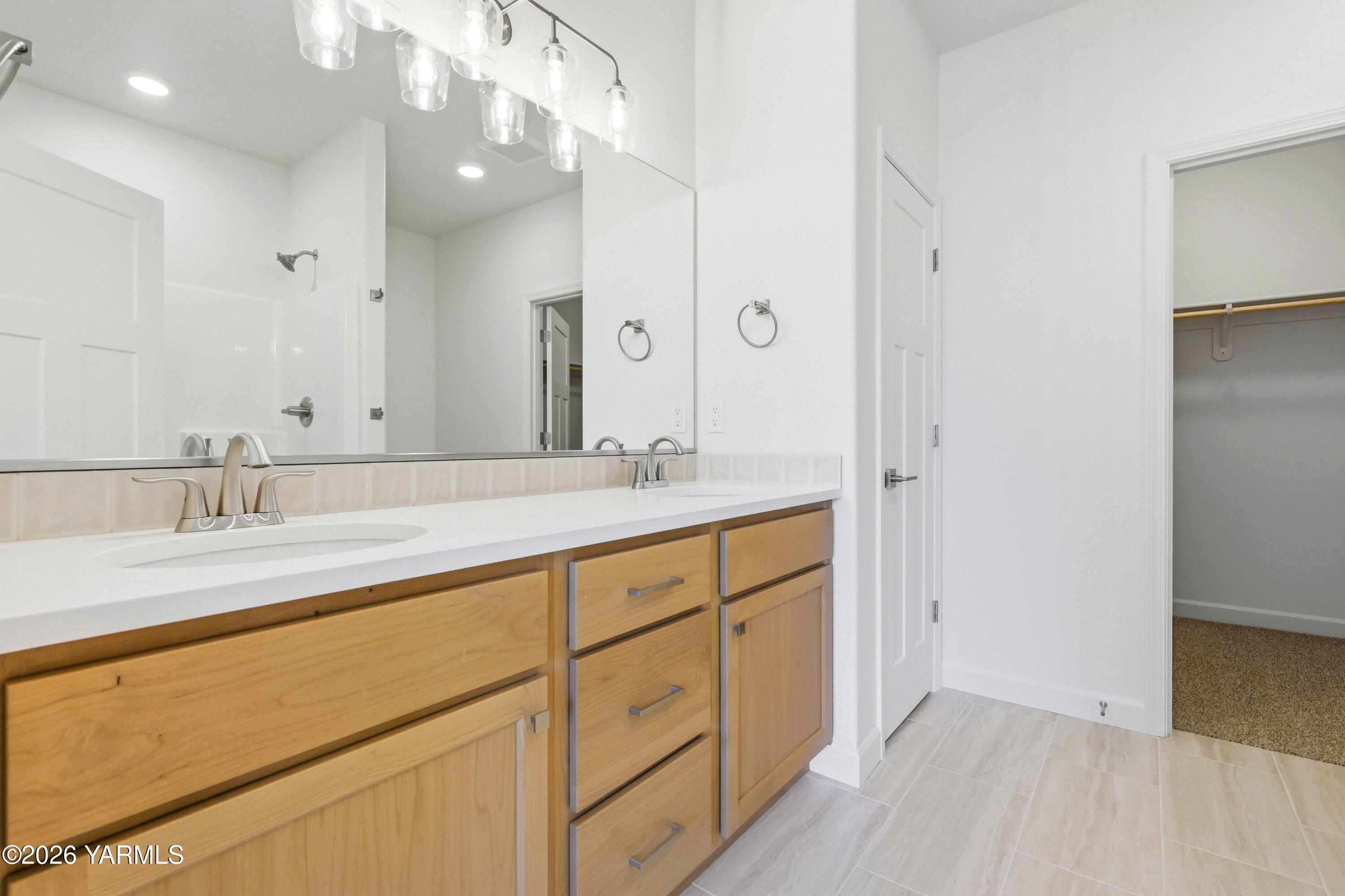 218 Packer Street Prosser, WA 99350 - Photo 22 of 36 a bathroom with a sink double vanity and a mirror