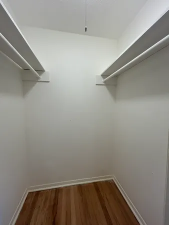 a bathroom with a sink toilet and a mirror