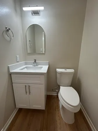 a spacious bathroom with a double vanity sink and mirror