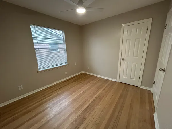a view of a hallway with closet area