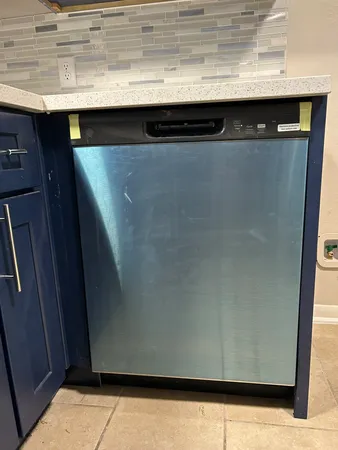 a view of a kitchen with a sink and a window