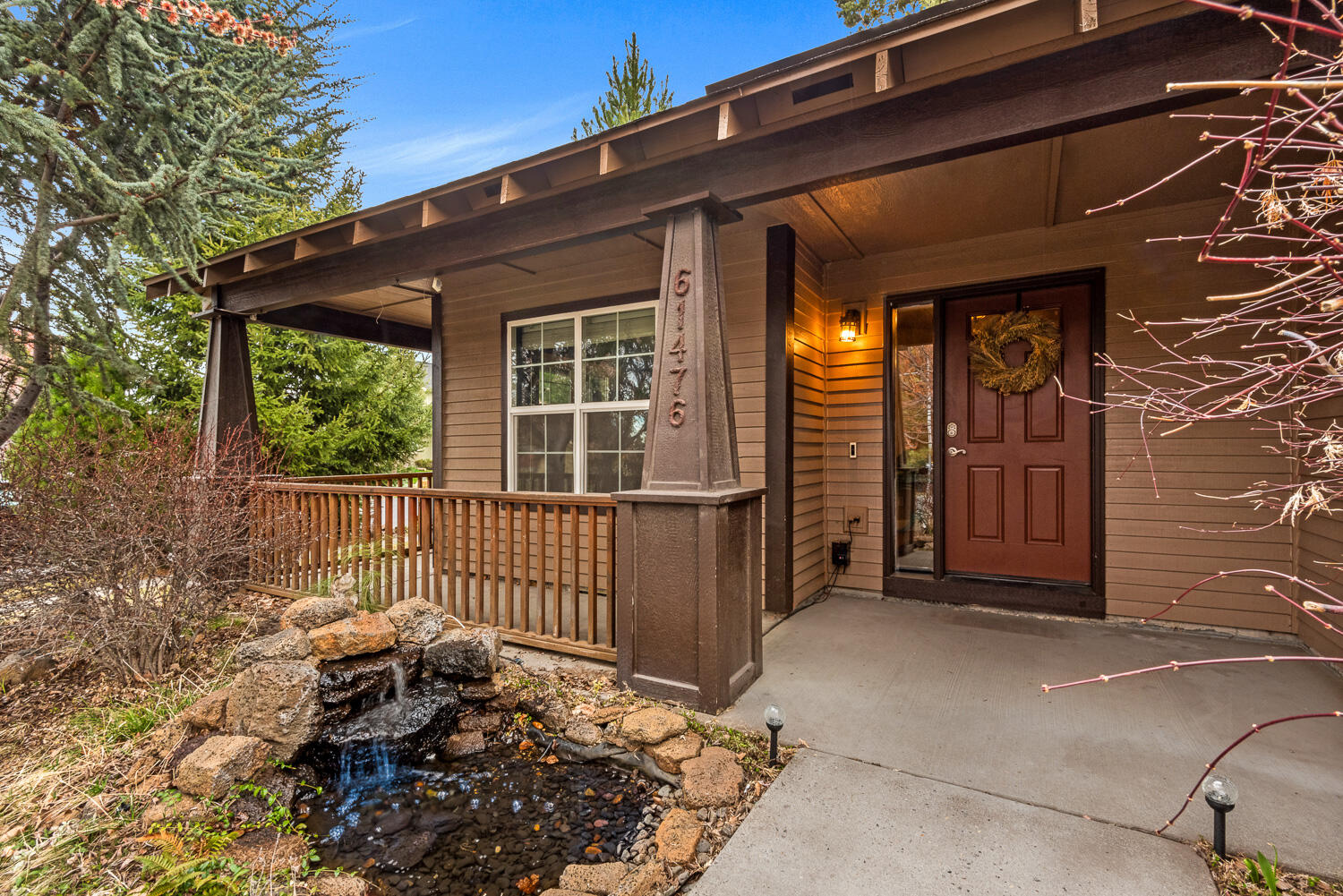 61476 Brosterhous Road Bend, OR 97702 - Photo 3 of 27 Covered front patio with water feature