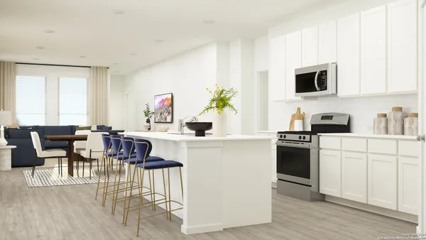 a kitchen with a table and chairs