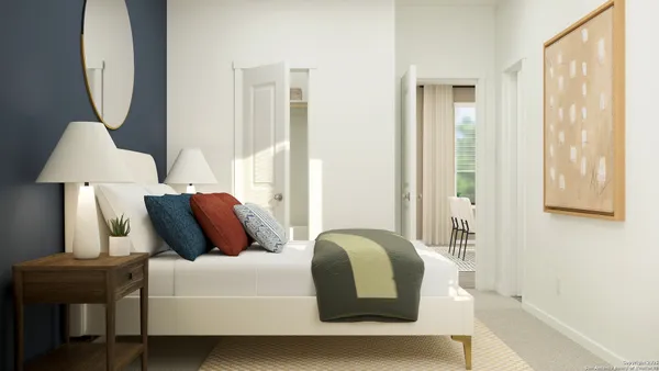 a bedroom with bed and a window