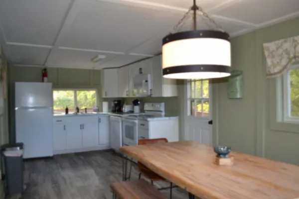 a kitchen with a sink a refrigerator and a stove