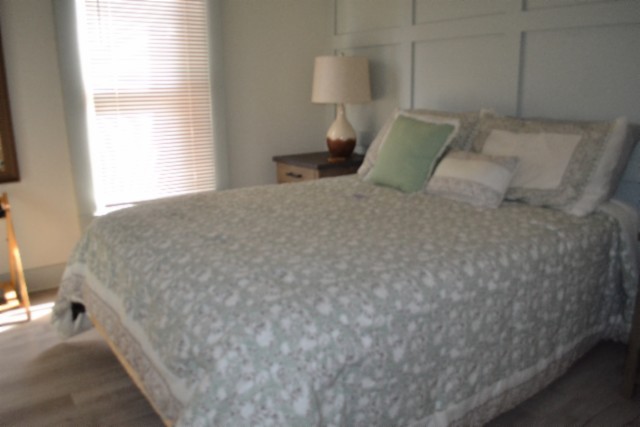 450 Cedar Hill Road Celina, TN 38551 - Photo 2 of 74 a bedroom with a bed and a night stand