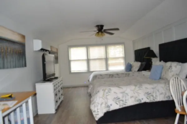 a kitchen with a sink a stove and cabinets