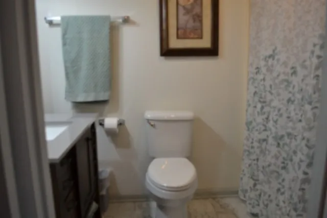 a bedroom with furniture and a flat tv screen