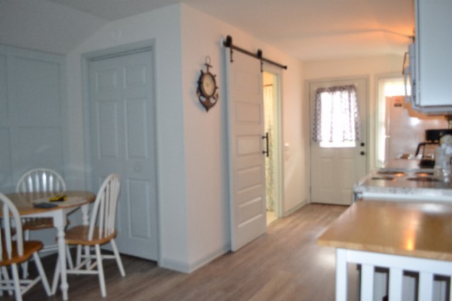 450 Cedar Hill Road Celina, TN 38551 - Photo 32 of 74 a view of a dining room with furniture window and wooden floor