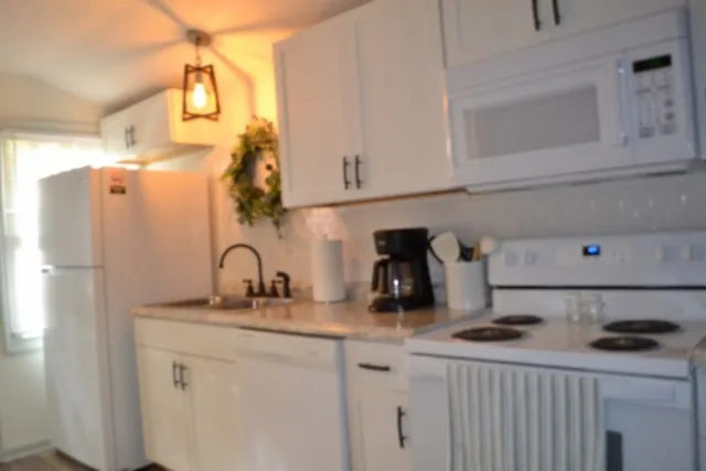 a view of a patio with table and chairs with wooden floor and fence