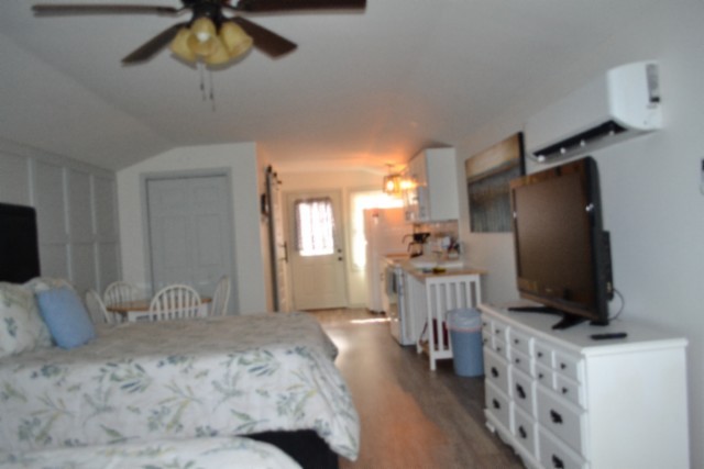 450 Cedar Hill Road Celina, TN 38551 - Photo 39 of 74 a bedroom with furniture and a flat tv screen