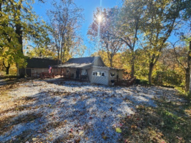 450 Cedar Hill Road Celina, TN 38551 - Photo 48 of 74 a backyard of a house with table and chairs