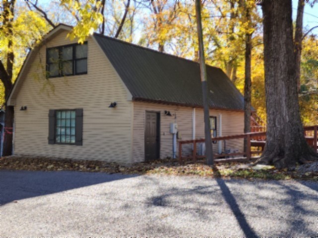 450 Cedar Hill Road Celina, TN 38551 - Photo 51 of 74 a front view of a house with a yard