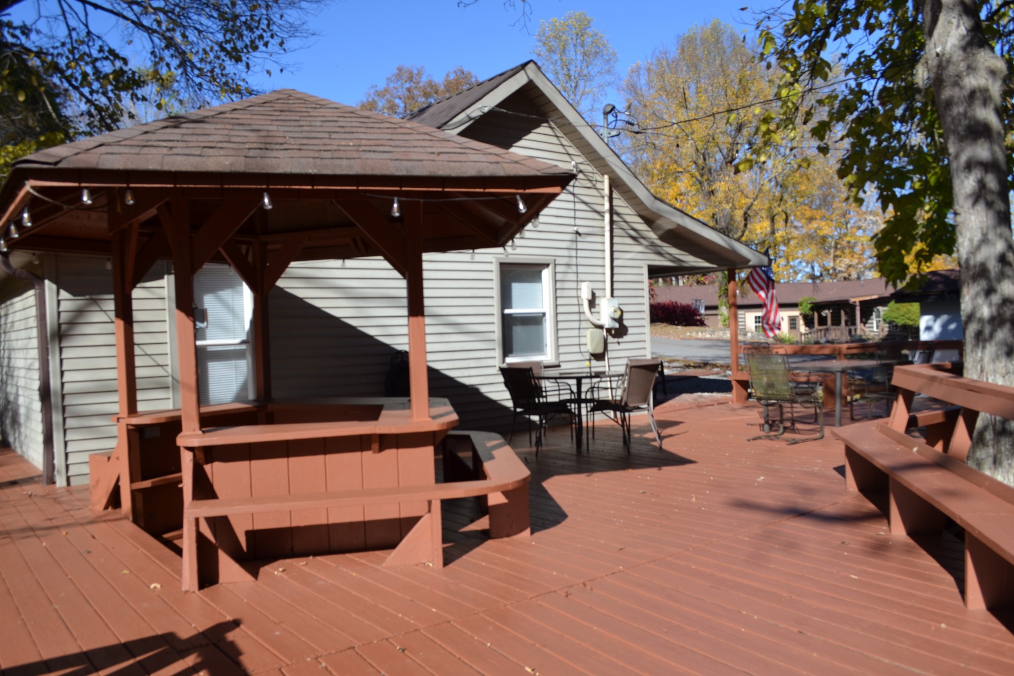 450 Cedar Hill Road Celina, TN 38551 - Photo 60 of 74 a backyard of a house with wooden floor and outdoor seating