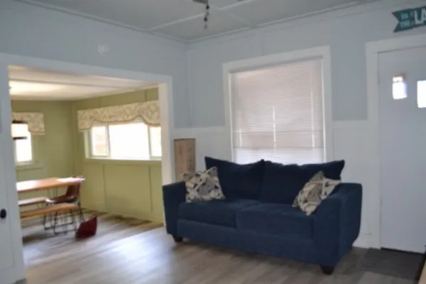 a living room with furniture and a potted plant