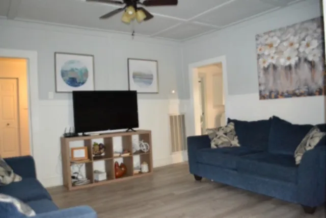 a kitchen with a refrigerator and a sink