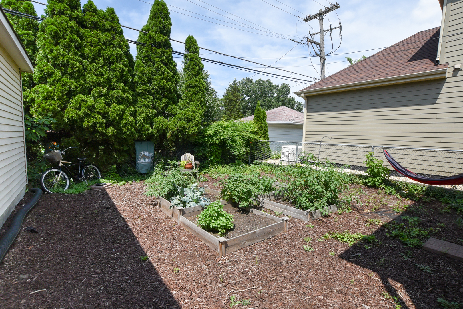 220 East Burlington Street Riverside, IL 60546 - Photo 26 of 31 a view of a backyard with potted plants