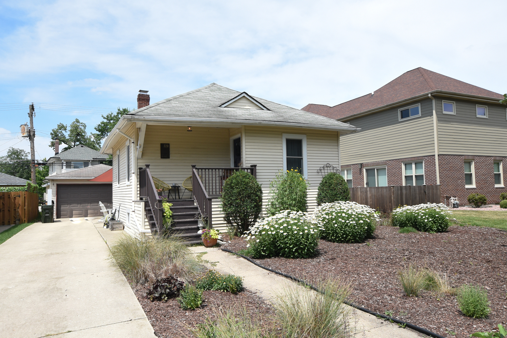 220 East Burlington Street Riverside, IL 60546 - Photo 3 of 31 a front view of a house with garden