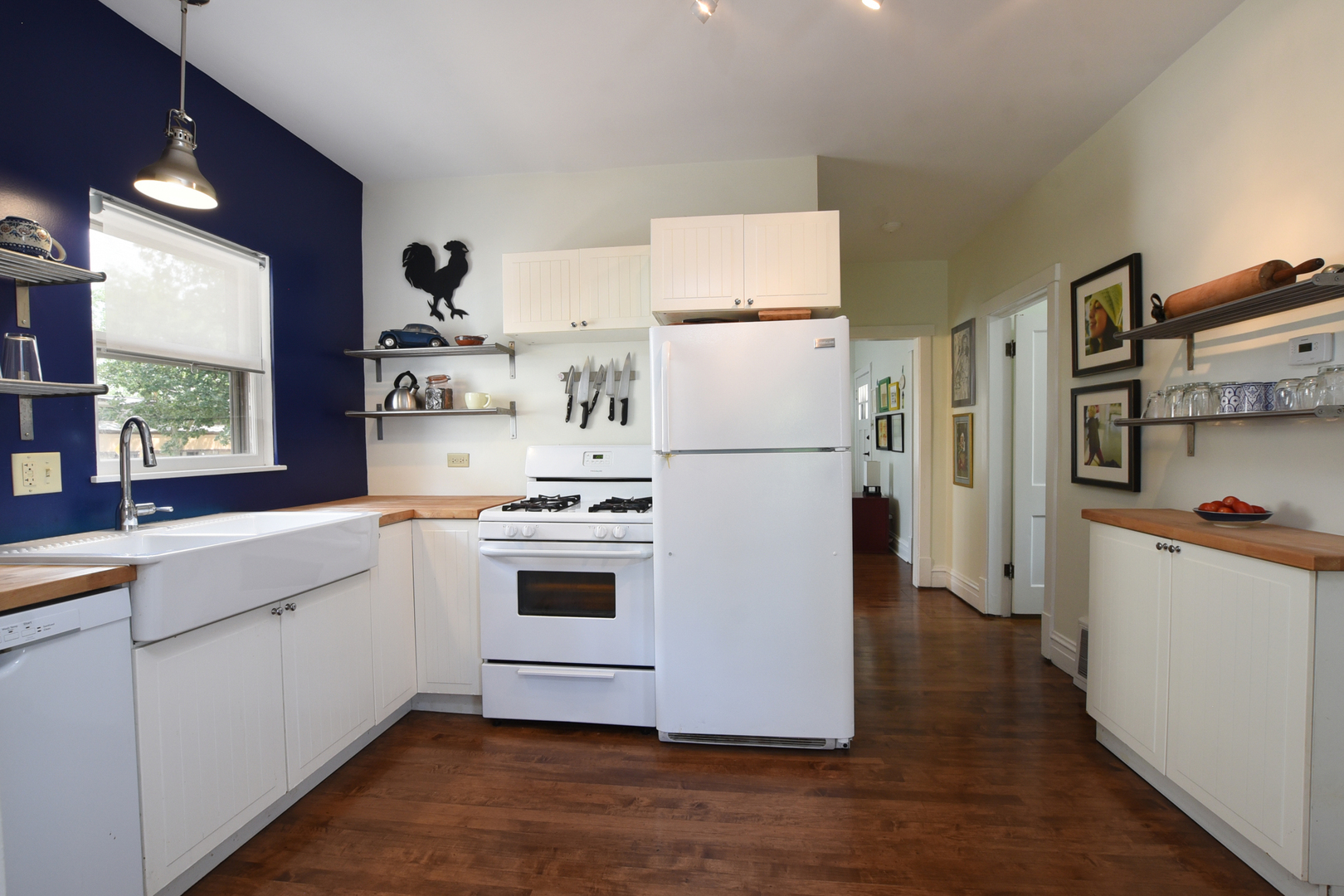 220 East Burlington Street Riverside, IL 60546 - Photo 9 of 31 a kitchen with cabinets a refrigerator and a sink