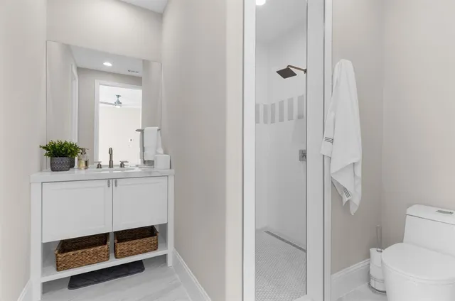 a living room with furniture and a lamp