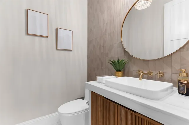 a utility room with sink dryer and washer