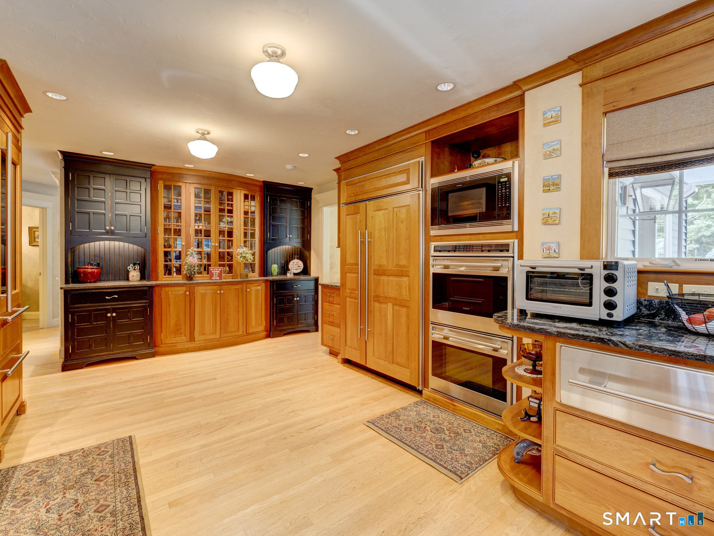 13 Executive Hill Road Wolcott, CT 06716 - Photo 10 of 40 a kitchen with stainless steel appliances kitchen island granite countertop a stove and a sink