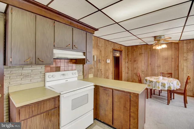 a view of room with furniture and wooden floor