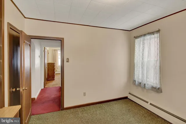 a bathroom with a granite countertop shower and a toilet